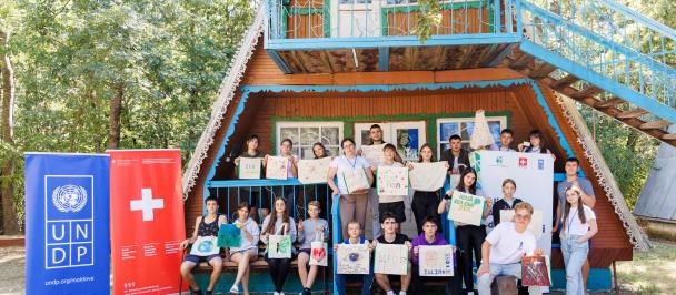 a group of people sitting at a zoo