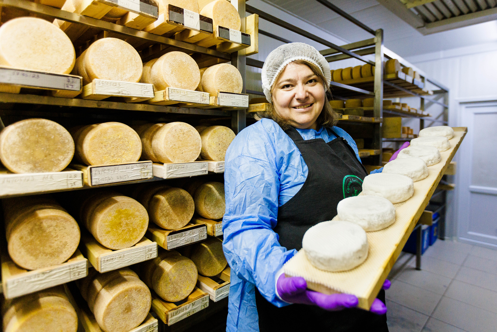 woman carrying cheese