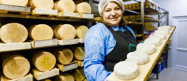 woman carrying cheese