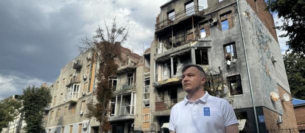 a man standing in front of a building