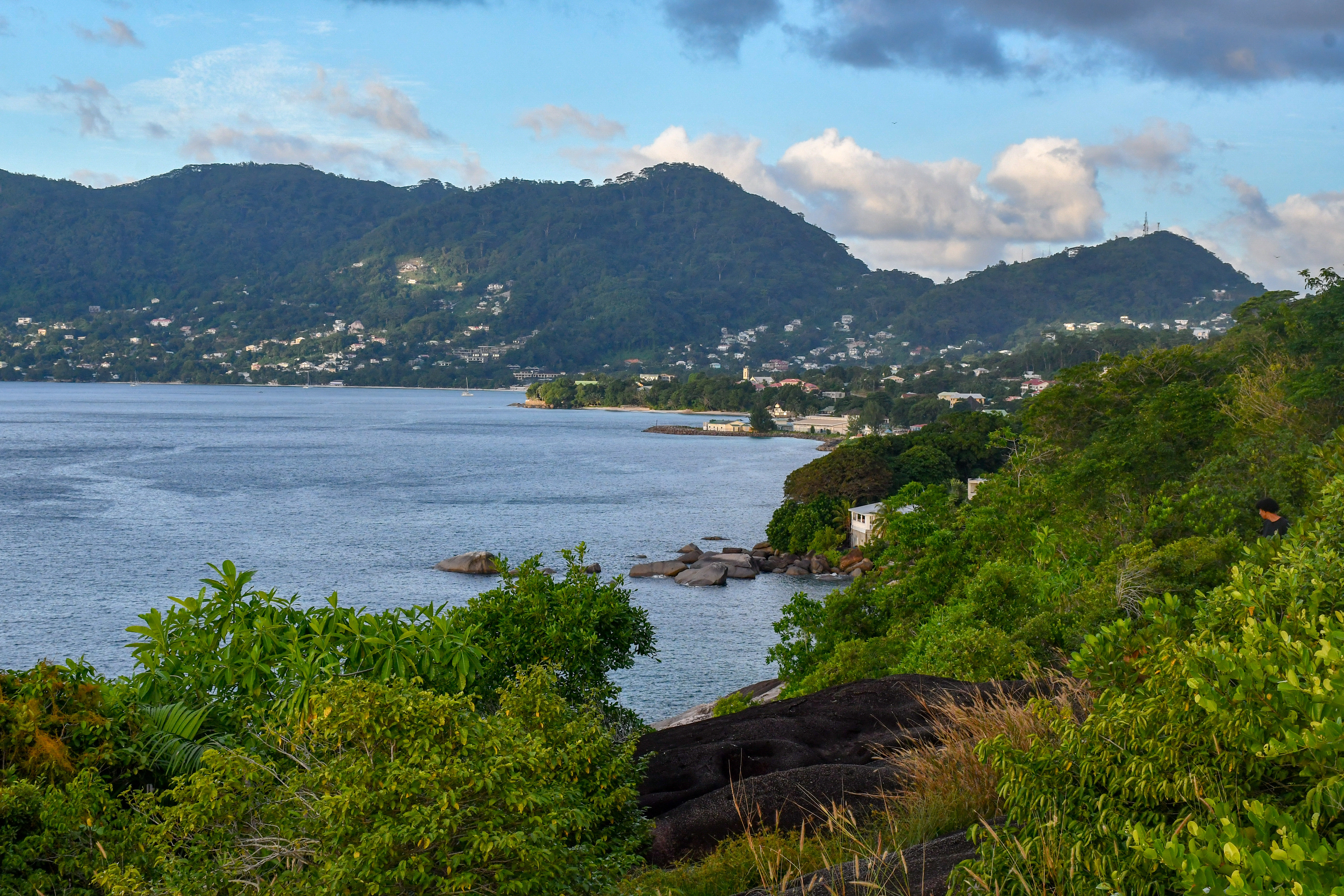 a body of water with a mountain in the background